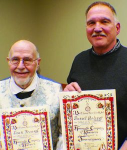 Left to right, Dean Freund and Daniel Boling with the Journeymen horner papers they received; next step is Master Horner.