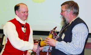 Carl Rumpke (left) presents the 1 of 1000 powder horn to Jim Fulmer (right) Past President of the NMLRA. (Photo courtesy Rick Sheets)