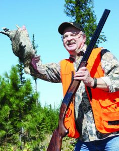 Author Workman with blue grouse and his favored Franchi 20-ga. over-under. 