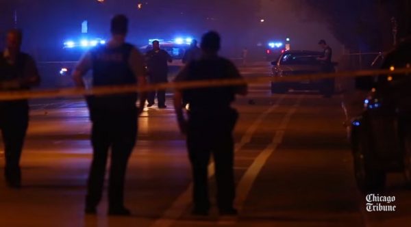 In this scene from a 2015 video, Chicago police investigate a homicide. (Screen snip, YouTube, Chicago Tribune) 