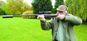 Famed white hunter and British “Best Quality” gunmaker Giles Whittome firing his original Maxim offset silencer on a Walther .22 specifically designed for use with a silencer. This .22 can be used as a semi-auto or a manually operated gun for maximum quietness, if desired.