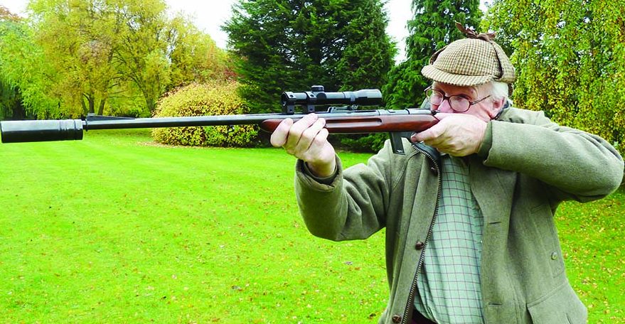 Famed white hunter and British “Best Quality” gunmaker Giles Whittome firing his original Maxim offset silencer on a Walther .22 specifically designed for use with a silencer. This .22 can be used as a semi-auto or a manually operated gun for maximum quietness, if desired.