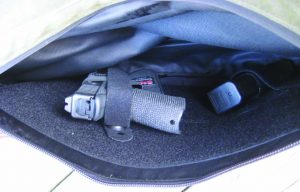 The author’s Overstreet Custom Glock 19 and a spare mag ride securely in the Galco briefcase insert holster set up.