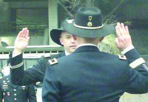 Author’s oldest son Mark, facing camera, being sworn in as a Lieutenant Colonel in the United States Army at Pulaski monument in Washington, DC.