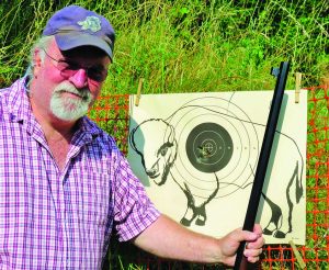 Jerry Mayo is pleased with his 5-shot group with the round balls at 25 yards.