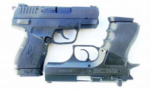 The XDE, left, compares well to traditional handguns such as the Baby Desert Eagle.  