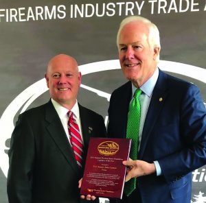 NSSF names Cornyn Legislator of the Year National Shooting Sports Foundation’s (NSSF) Senior Vice President and General Counsel Larry Keane (left) stands with Senate Majority Whip John Cornyn (R-TX) after Cornyn received the firearm and ammunition trade association’s 2017 Legislator of the Year award for his sponsorship of S-2135, the Fix NICS Act, at the organization’s annual dinner in Washington, DC, in April.