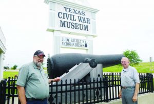 Author, left, and his oldest brother Elmer, right, standing with a 10-inch smooth bore confederate coastal gun with a range of 2.8 miles in front of the Texas Civil War Museum.