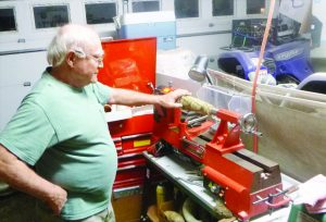 Master Horner Walter Mabry is standing in his Mississippi shop where he makes powder horns.