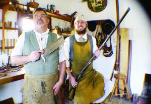Master Gun Builder Blake Stevenson (left) is with Apprentice Bruce Stroud, who is holding a T. Vogler rifle.