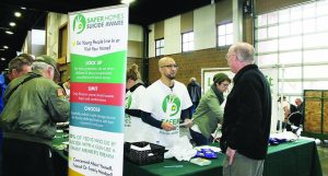 Volunteers for the Safer Homes suicide prevention program in the Northwest spoke with gun owners at the Washington Arms Collectors gun show last fall. (Dave Workman)