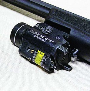 Close-up of the light toggle and the silver selector switch for the Streamlight TLR2 HLG. This light makes the PC9 a night fighter.