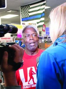 Rick Ector of Legally Armed in Detroit answers questions from a local television reporter.