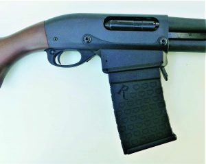 Remington’s magazine fed 870DM proved reliable in action. Note receiver modifications.