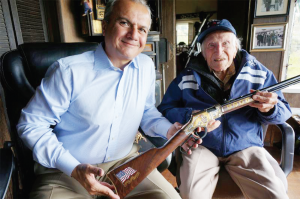 Louis Zamperini, World War II hero (right), receiving a custom Henry Military Service Tribute Edition Rifle from Anthony Imperato, president of Henry Repeating Arms. (PRNewsFoto/Henry Repeating Arms)
