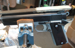 The author’s modified file for lowering front sights. The plastic creates a safe area that glides over the top of the rear sight keeping the cut on the front sight square with the top of the rear.